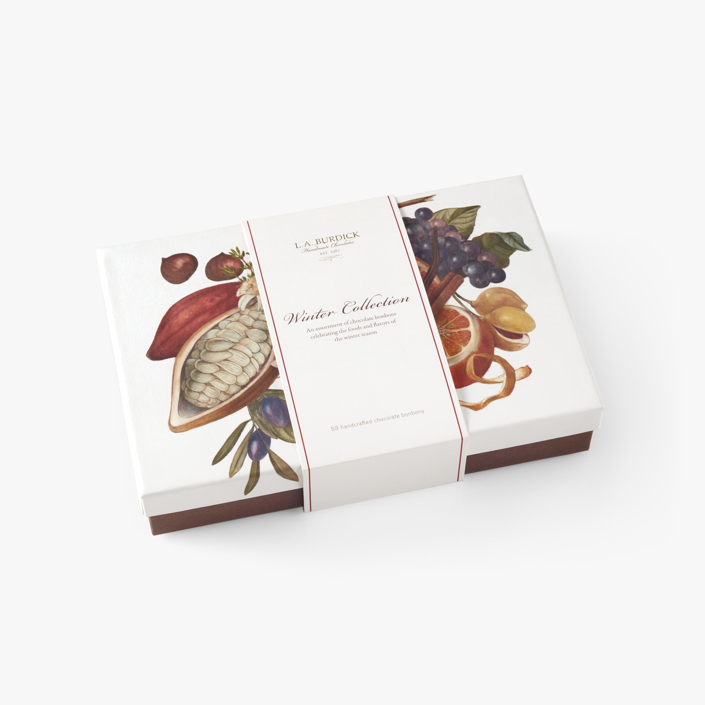 Closed chocolate box with beautiful seasonal illustration showcasing ingredients used in the chocolate bonbons.